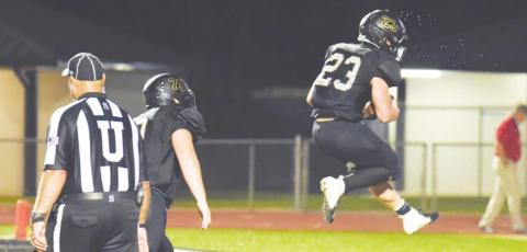 Trenton Conn jumps for joy as he scores the game winning overtime touchdown versus Brazosport Friday.