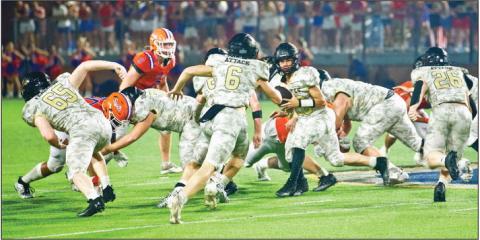 Pirate QB Daigan Venable hands the ball off to #6 Dane Villadsen as #65 Blane Ragan other unidentified linemen and #26 Riley Marlow block. Photo by Randall Luker