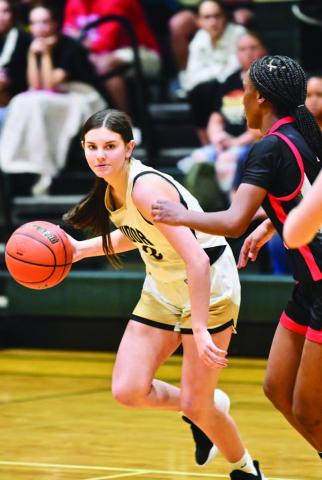 Allie Williams makes a break for the basket.