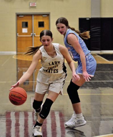 Lady Pirate Madison Powell drives on the goal in Friday’s district opener versus Lumberton. Photo by Randall Luker