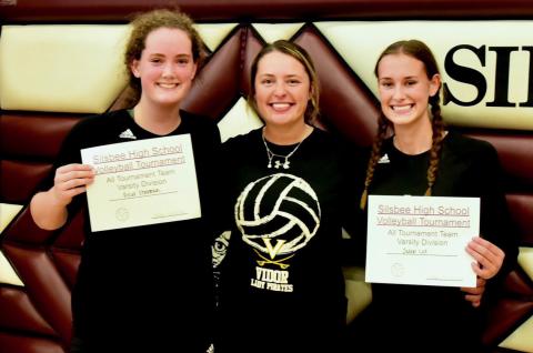Rylee Sherman, left, and Jaden Lee, right were named to the All Tournament Team at the Silsbee Volleyball Tournament Saturday. They are pictured with Vidor’s first year Head Volleyball Coach Brooklyn Sampere. Photo by Randall Luker