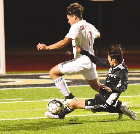 Samuel Estupinan slide tackles a BC Cardinal at home Friday.