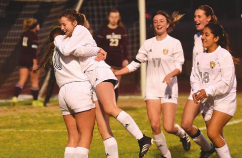 Teammates congratulate Chloe Post after she scored her fourth goal of the night against Silsbee, Pictured left to right are Taylor LaPray, Post, Amelia Wright, Jaden Lee and Johana Aguirre. Photo by Randall Luker
