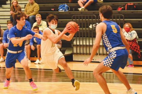 Aiden Ochoa drives on the goal between Kelly defenders Tuesday night.