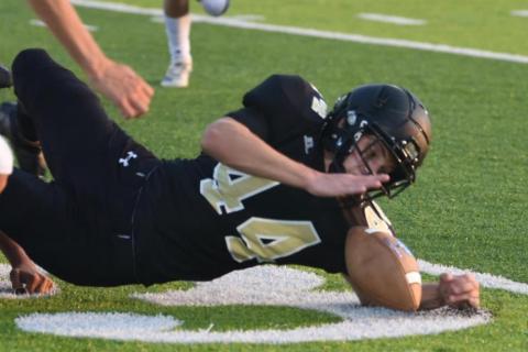 Tate Ardis recovers a Buna fumble Friday. Photo by Randall Luker