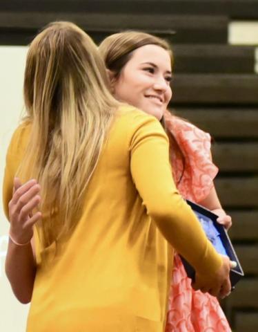 Coach Brooklyn Sampere presents Ava Lightfoot the Offensive Player of the Year Award in Volleyball.