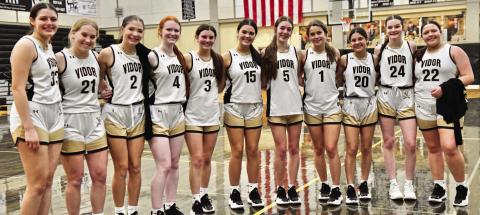 The Lady Pirates pose for a team photo after their 78-42 win over district foe Jasper.