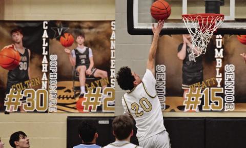 Bryson Aguilera, just moved up from jv, lays up two before the half.