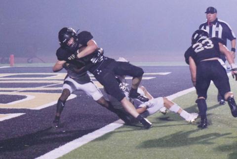Pirate RB Jason Watson caps a 10-yard run with a touchdown in fourth quarter action Friday.