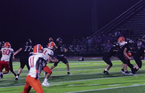 The Throw - Jarrett Odom lets fly a 30-yard TD pass to Daigen Venable who got behind the Saints’ defense and caught the ball in stride for a touchdown to put the Pirates up 45-14 with 2:19 left in the third quarter. Photos by Randall Luker