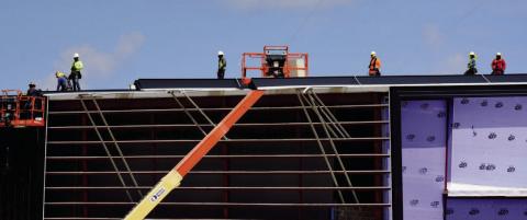 Contractors brave the sweltering heat to install the metal roofing on the Vidor Middle School Monday. Some of the rooftop HVAC units have been placed on previously completed areas of the structure. VISD Superintendent Dr. Jay Killgo said he receives construction updates weekly. “Things seem to be moving along well on the project and we are hoping for a mid-year move in.'