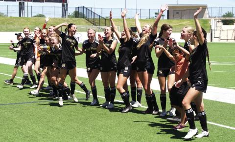 The Lady Pirates join with fans to sing VHS’ school song, Hail Alma Mater following the team’s victory over the Giddings Lady Buffs.