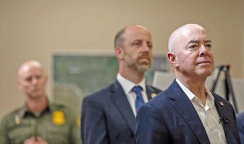 U.S. Secretary of Homeland Security Alejandro Mayorkas, right, listens as President Joe Biden receives a briefing from U.S. Customs and Border Protection, USCIS and ICE during a visit to Brownsville on Thursday, Feb. 29, 2024. Credit: Eli Hartman/ The Texas Tribune