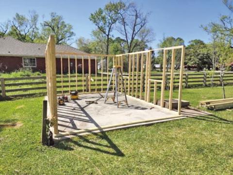 The greenhouse framing utilizes non-treated 2 x 4 x 8 lumber from a friend’s lumber stockpile. The 2 x 4’s (studs) were anchored onto a base plate at 2-foot centers. The lumber used for the base plates are weather resistant boards (image: John Green).