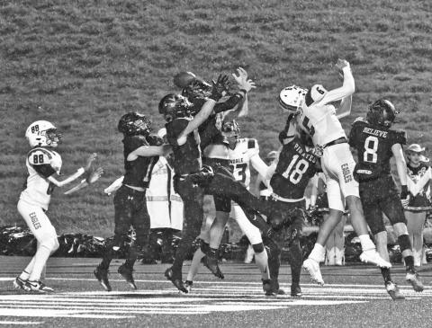 Up for grabs Pirate defenders outnumbered Eagle receivers five to three in the end zone but the last man in line, Chad Ward, #88, caught the deflected ball for a Lindale touchdown with seconds left in the first half.