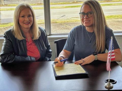 Pictured is Mayor Misty Songe presenting CTE Director Penny Singleton with a signed Proclamation Document.