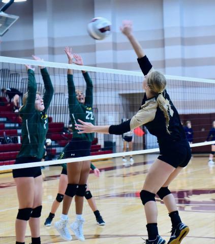 Junior varsity Lady Pirate Jaelyn Justice returns the ball in Saturday’s game versus LCM.
