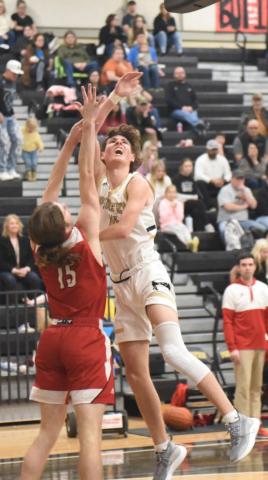 Zander Lindsey shoots during Tuesday’s game versus Bridge City. Photo by Randall Luker