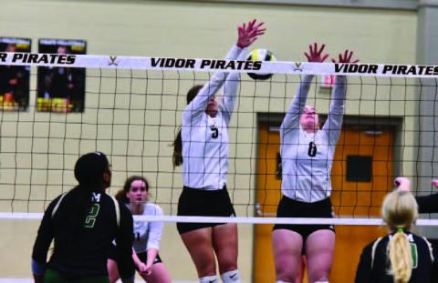 Lady Pirates Rylee Sherman, rear left, Madison Powell and Natalie Morrison defend agains the LCM Lady Bears. Photo by Randall Luker