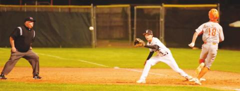 Pirate first baseman Easton Walker keeps his foot on the bag as he awaits the throw for a Bobcat out.