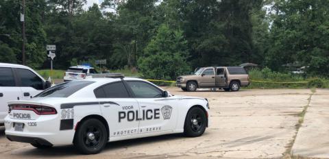 Investigators tape off the area where the body of a Bon Wier man was found Wednesday off FM 1132 near the State Highway 12 intersection. Courtesy Photo