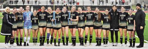 The Vidor Lady Pirates are all smiles as they pose with their two trophies for winning the HJ soccer tournament and scoring the most goals.
