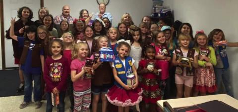 Girl Scouts Troop 130458 made a donation to Living Waters Homeless Ministry (LWHM). LWHM is a ministry of the Source of Old Faith Baptist Church. The girls collected food for the homeless. They also voted unanimously to donate their '10% give back' from their Fall Product sales to the ministry. Danny Beard, founder of LWHM and Mike Tanner, Pastor of the Source of Old Faith Baptist Church were presented with a check. Courtesy Photo