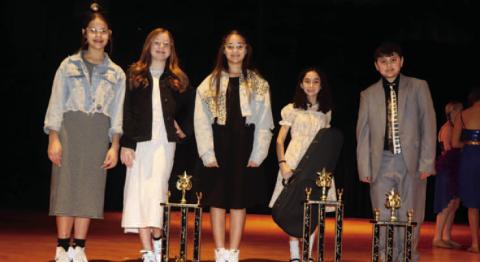 Junior competition winners from left to right: Brylee Lofting, Brynna Loftin and Kortlyn Hennessy won 2nd place for their vocal trio, Hope Nielson won first place for her vocal/instrumental, and William Nele took 3rd place for his piano solo.