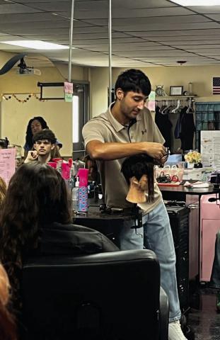 Former VHS student Aiden Ochoa owner of Haircuts By Aiden Ochoa in Beaumont was a guest speaker in the Cosmetology classes last week. Aiden demonstrated to the Cos students how to do the different “Fade” techniques & mens cuts. Mr. Ochoa also answered student questions about careers in Cosmetology. A special thanks to Aiden for sharing his time with our students!