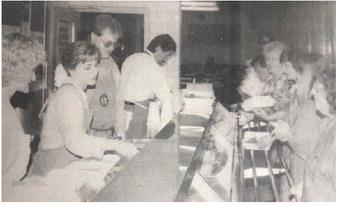 Vidor Rotarians, left to right, Karla Rogers, Suzanne Harris, Curtis Collum, Randy Wright, dish up the fish and chicken for hungry supporters at their annual fund raising dinner Monday night at the Vidor Junior High School cafeteria. There was a repeat performance Tuesday evening.