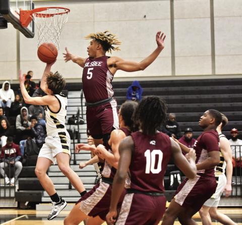 Jose Guerrero-Evans attempts a layup in Friday’s varsity game versus Silsbee. Photo by Randall Luker