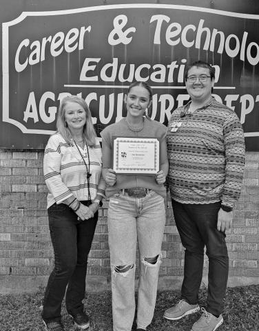 Ag teacher Mr. Tyler Root with Zoe Huntman and CTE Director Penny Singleton
