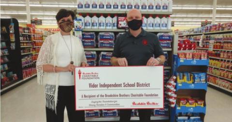 The Brookshire Brothers Charitable Foundation proudly presented a grant to the Vidor Independent School District on Wednesday, February 24, 2021. Pictured from left to right: Sally Andrews, VISD; and Robert Williamson, Brookshire Brothers store director.