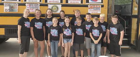 Before the Fill the Bus School Supply Collection Drive was postponed last Saturday morning, the Vidor Middle School Pirate Council posed for this picture in front of the big yellow school bus parked in the Walmart parking lot. But, grey clouds were forming and getting ready to open up with lightning and rain. Archive Photo