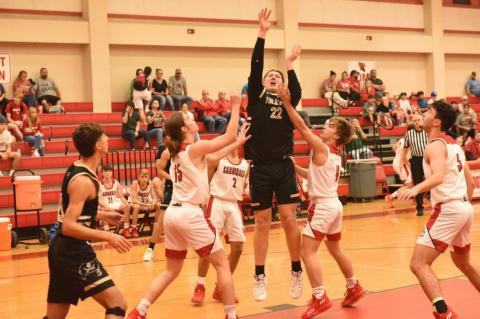 Dalton Cash, 6’4” Pirate senior, shoots and scores Friday in the Pirates district opener in Bridge City. Photo by Randall Luker