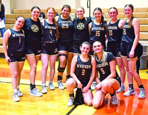 Still undefeated The varsity lady Pirate basketball team pose for a team photo following their 33-32 win over the Orangefield Lady Bobcats. With the win, the Lady Pirates record is 5-0.
