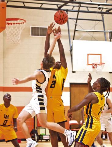 Taking a shot Jose Guerrero-Evans takes a shot in the Pirates’ game with LaMarque at the Bill Tennison Memorial Basketball Tournament in Orangefield.