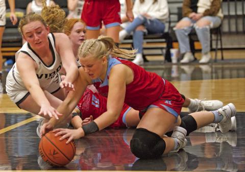 Scramble for Possession Lady Pirate Natalie Morrison and a Lumberton Lady Raider go to the floor for possession of a loose ball Wednesday in a district match.
