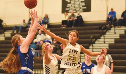 Sofia Rodriguez gets a hand in to block a Lady Cougar.