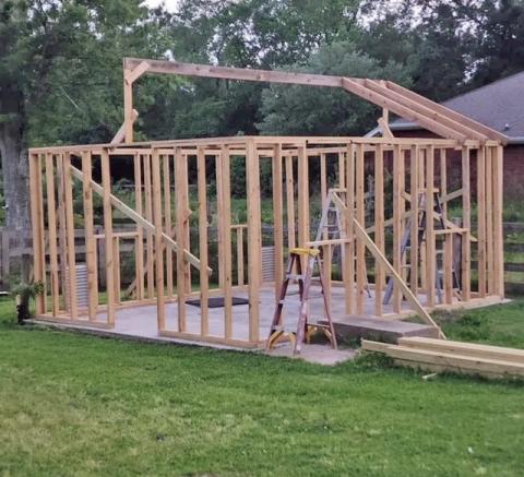Framing the roof was challenging for us and required a good bit of energy, especially while climbing ladders, holding the lumber into position, manipulating screws and drills to secure the boards into place (image courtesy: John Green).