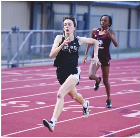Lady Pirate Amelia Wright stretches out in the 400 meter run. Wright won the event with a time of 1:03.1. The VHS junior also won the 800M and ran a leg of the Lady Pirates’ winning 1600M relay team.