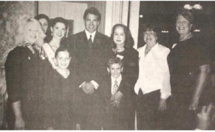 Pictured with Texas Governor Rick Perry at roast of retiring State Representative Ron Lewis are, from left, Chrystal Reeves, Lena Rambo, Miss Texas USA Nicole O'Brian, Brandi Motte, CASA Executive Director Jane Stevenson, Corby Stevenson, Ellen Hay and Sharon McMullen.