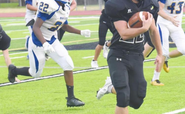 Pirate JV running back Caleb Dean finds plenty of running room as he rounds the corner over the right side against the Bay City Blackcats Thursday, Photo by Randall Luker