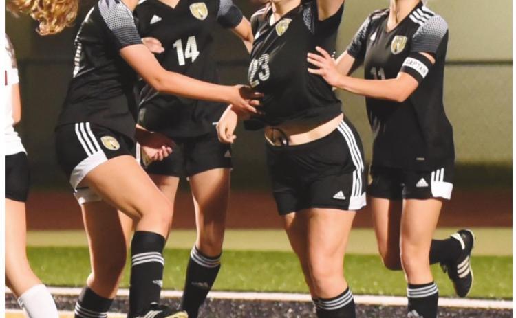 Lady Pirate teammates congratulate Alaina Davis #23 after her goal against Jasper Tuesday.