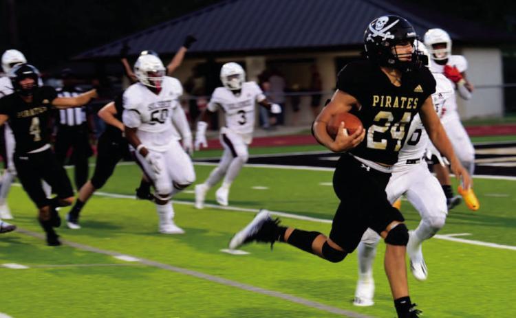 Pirate QB Jarrett Odom heads for the end zone and Vidor lone TD Friday after a Brayden Root interception gave Vidor the ball on the Silsbee 16 yard line. Photos by Randall Luker