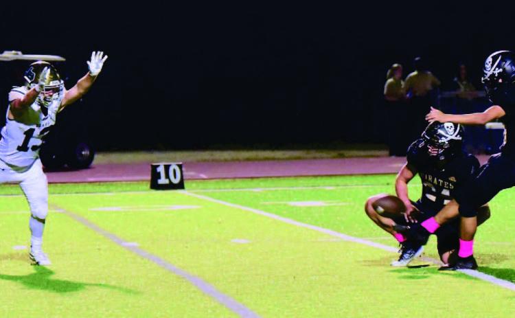 Pirate PAT kicker Sammy Estupinan and holder Jarrett Odom were a perfect four of four versus LCM Friday. Photo by Randall Luker