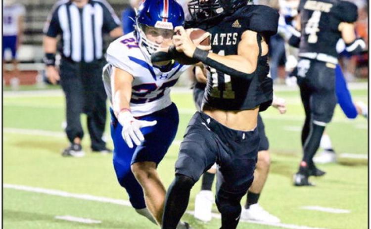 Bryce Dubose eluded numerous Trojan defenders to score on a Pick 6 Friday versus the Trinity Christian Academy Trojans. Photo by Randall Luker