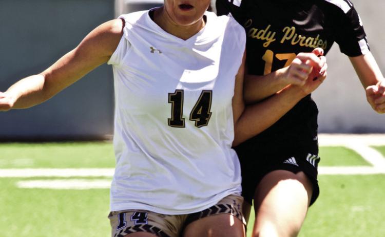 Eyes on the Ball Lady Pirate Jordyn Fowler and a Giddings Lady Buff concentrate on the ball as they await a throw in.