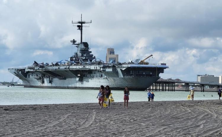 Volunteers help clean up a beach near the U.S.S Lexington Museum in Corpus Christi, Texas. Courtesy Photo