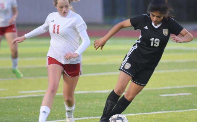 Junior Varsity Lady Pirate Catherine Gaspar dribbles past a Cleveland player Tuesday at pirate Stadium. Gaspar scored Vidor’s lone goal in a 9-1 loss. Photo by Randall Luker